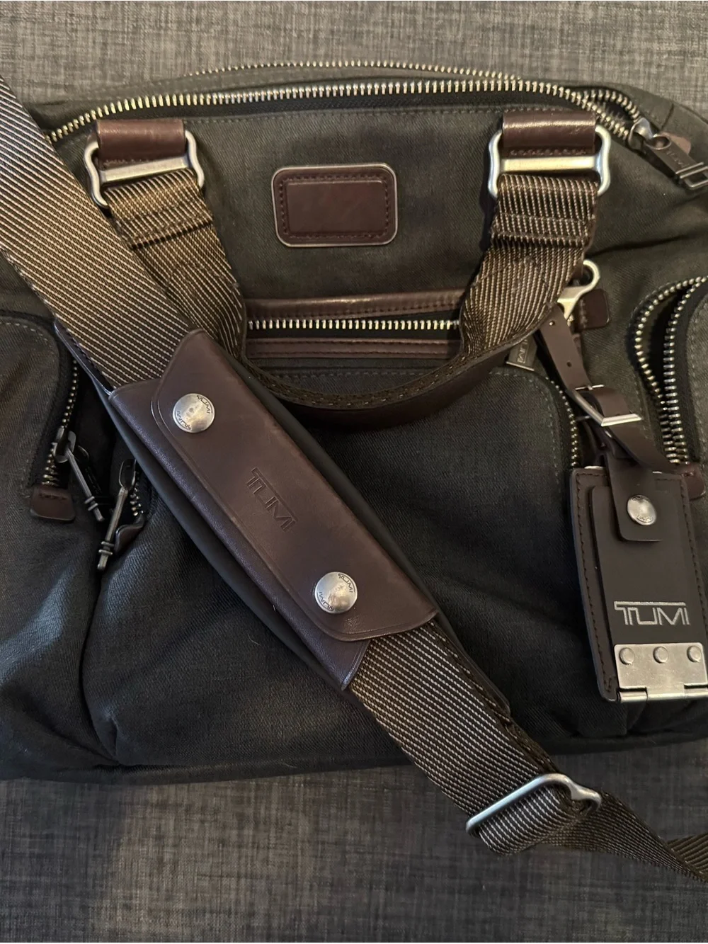 Tumi Black Canvas Messenger Bag with Brown Leather Trim